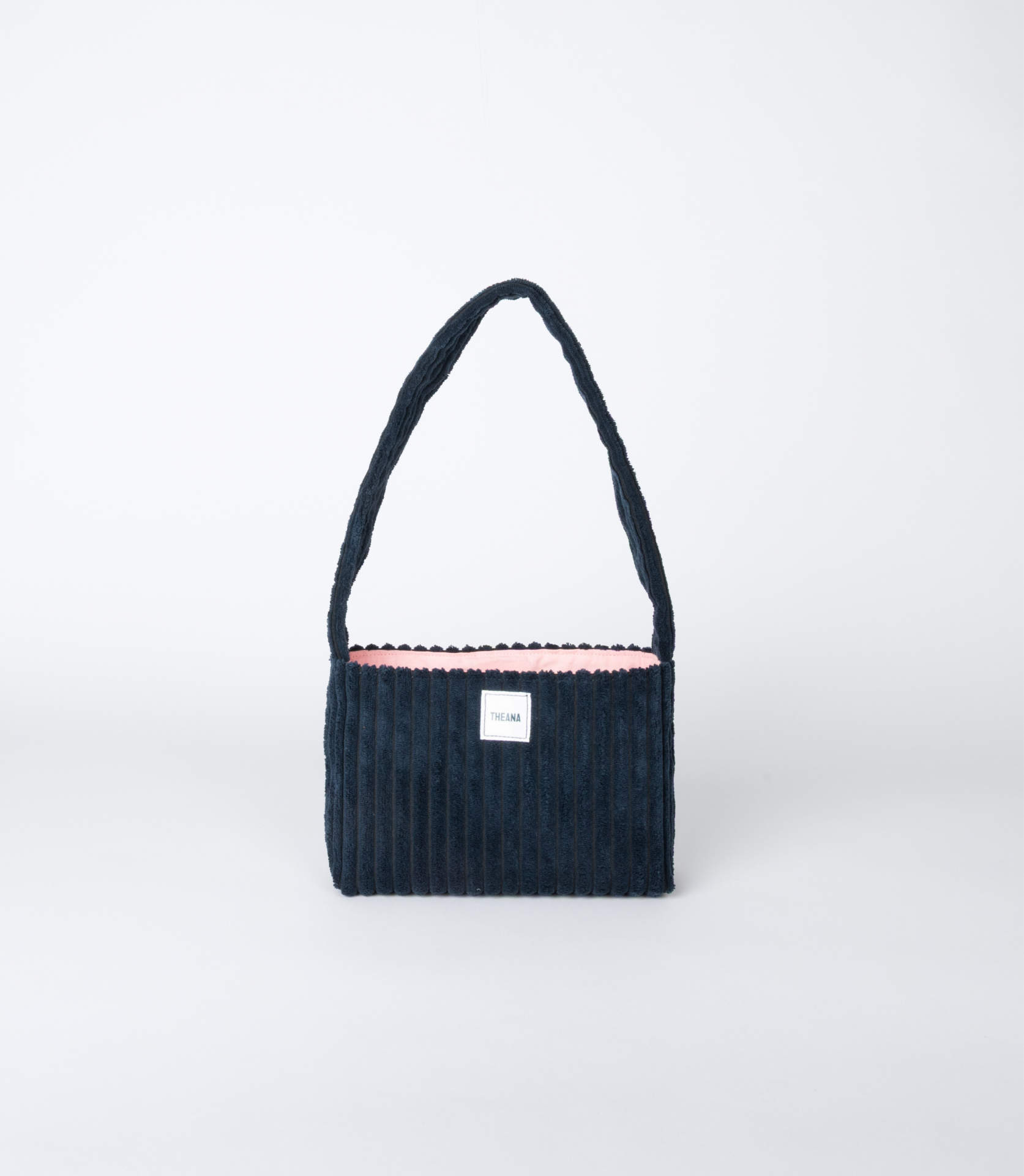 mini sac bleu marine en velours côtelé avec doublure rose et bouton aimanté – marque THEANA
